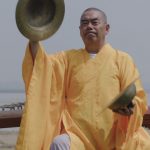Elderly monk playing cymbals - Music Monks - THIS Buddhist Film Festival