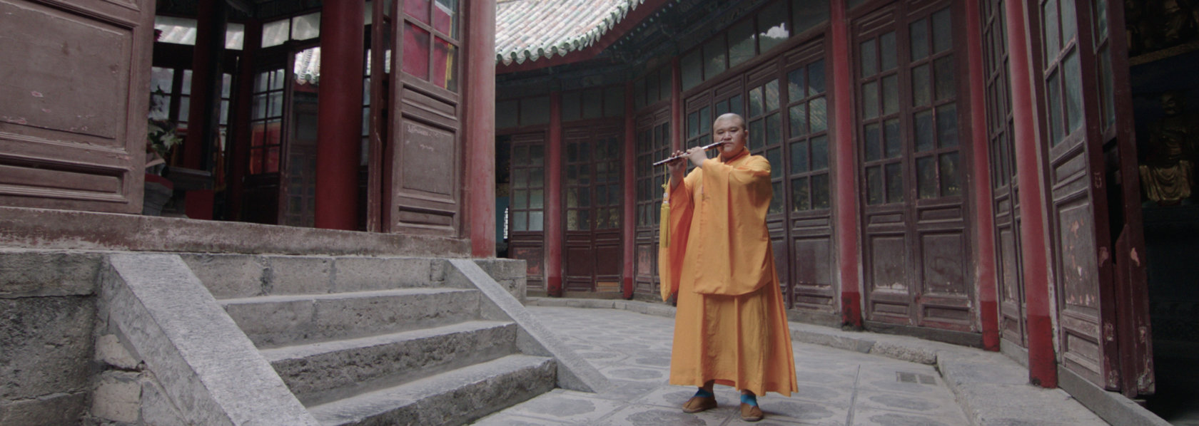 Monk playing Chinese flute in a temple - Music Monks - THIS Buddhist Film Festival