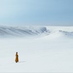 Lama standing in snow winter mountain - THISBFF - The Medicine Buddha