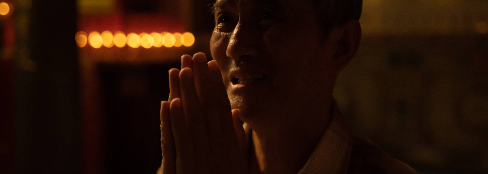 出家 LEAVING HOME - Frowning father with palms together in prayers - THIS Buddhist Film Festival