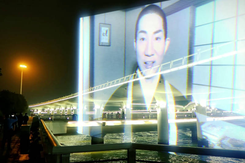 WAKING UP 2050 - Projection of a person on a bridge - THIS Buddhist Film Festival