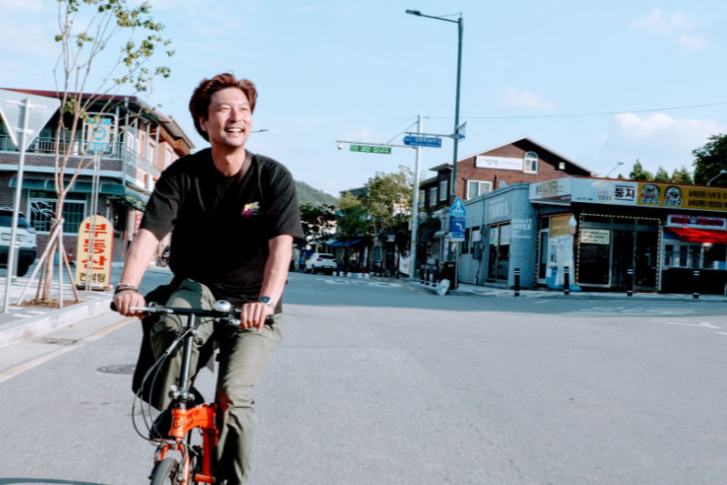 I LEAVE HOME - Man riding bicycle on the street - THIS Buddhist Film Festival